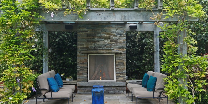 Outdoor pergoalla with fireplace